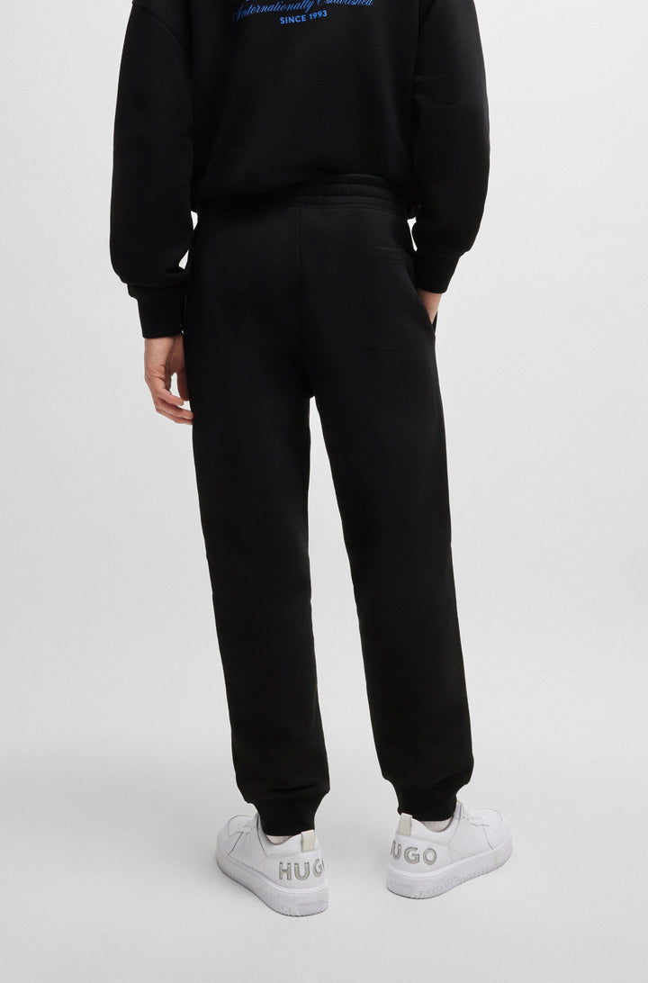 HUGO Jogging Pants Loose Fit in Cotton - NEVEZ 10257685 01-50510734- Concorde Fashion#color_black-001