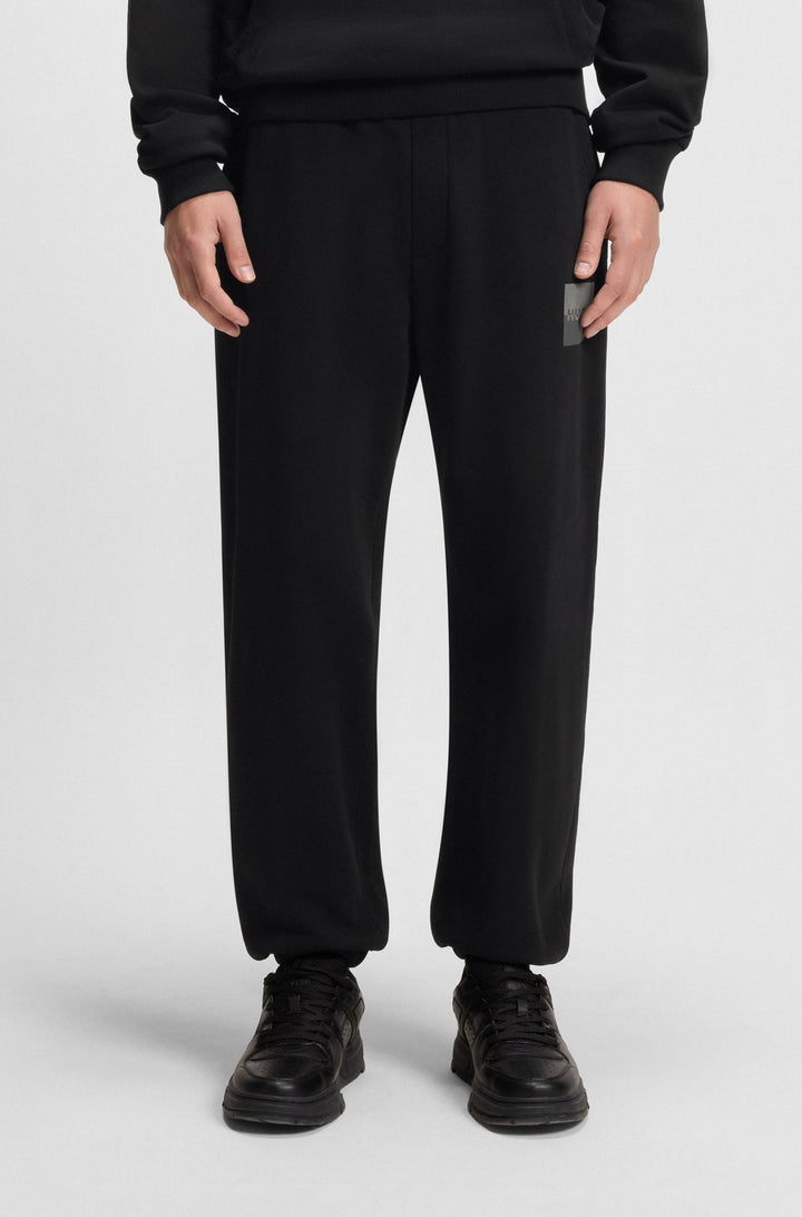 HUGO Jogging Pants Relaxed Fit - DUSPLITAN 50542866Concorde Fashion#color_black-001